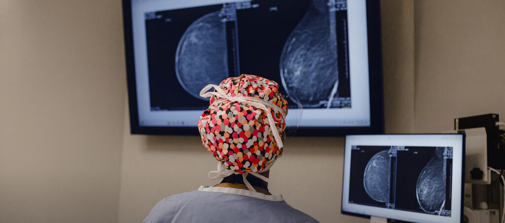 healthcare professional looking at scan in hospital